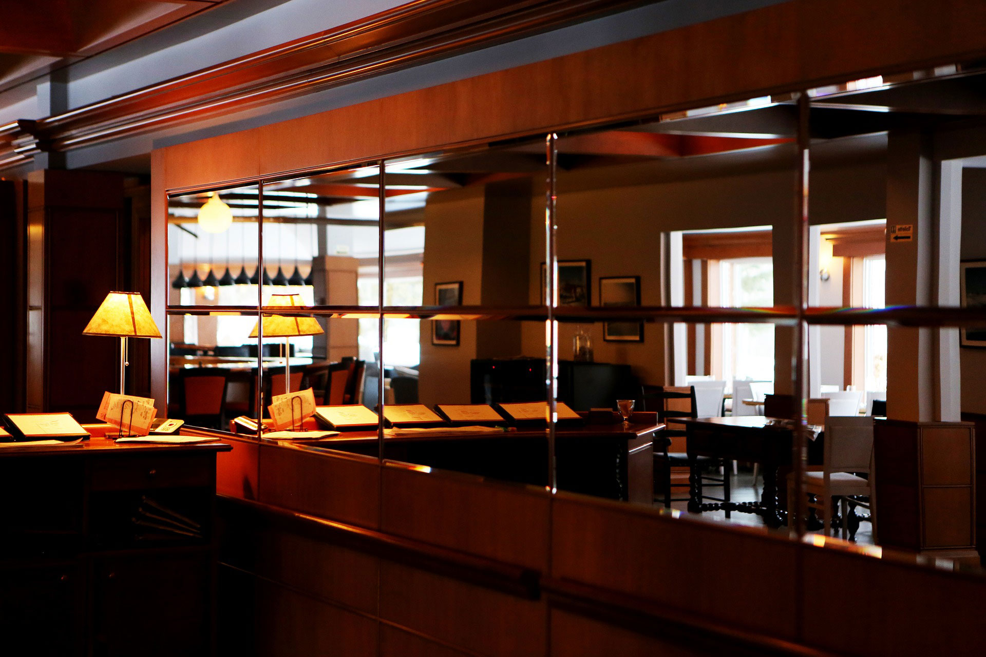 internal photo of restaurant reflected in mirrors on walls