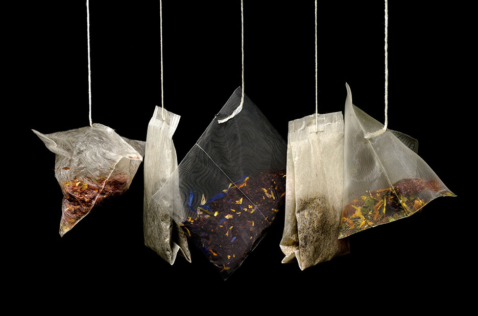 bags of different types of tea hanging